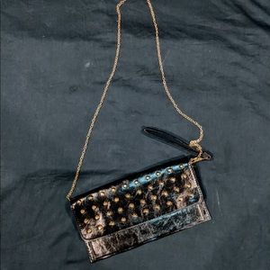 Gold studded faux leather purse